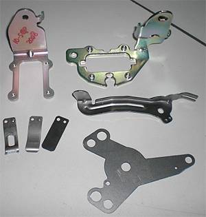 Selection of stamped parts from the motorcycle and automotive section of the company profile